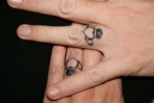  Calddagh Heart ring design tattooed as their wedding bands